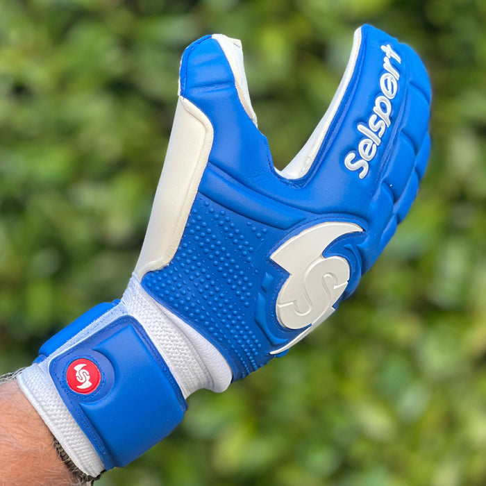 Blue Seslport goalkeeper  glove with branding on a green background