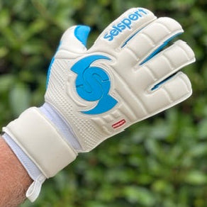 Selsport white & cyan goalkeper glove on a blurred green backgound