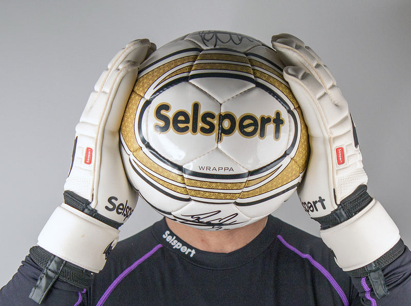 Wrappa Classic Selsport Professional rollfinger goalkeeper gloves holding a football in front of a head