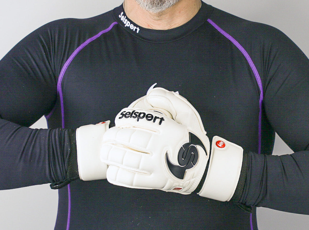 Selsport Ultimate UA+ Wrappa classic hybrid flat palm cut goalkeeper glove backhand with s wing logo in game ready pose
