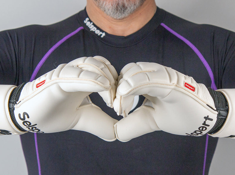 Wrappa Classic Selsport Professional rollfinger goalkeeper gloves in a heart hand pose
