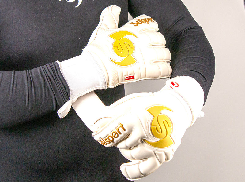 Selsport Professional Goalkeeper glove Wrappa Classic EA+ Gold being put on the wrists