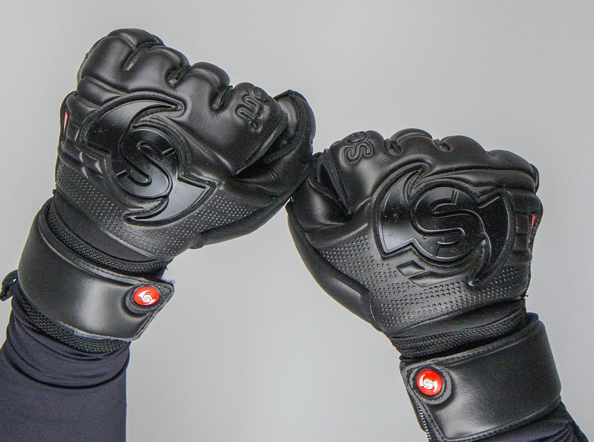Selsport Wrappa Classic Professional Rollfinger goalkeeperglove in all black with pro wrist strap in a fist pose