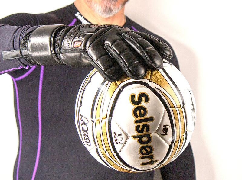 Selsport Wrappa Classic Professional Rollfinger goalkeeperglove in all black with pro wrist strap holding a football with one hand